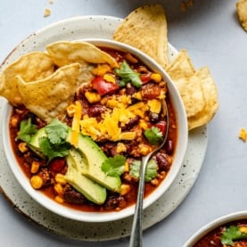 healthy turkey chili in a bowl with toppings